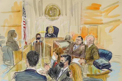 This artist sketch depicts Judge Dabney Friedrich looking out from the bench during jury selection for Guy Wesley Reffitt, joined by his lawyer William Welch, top right, in Federal Court, in Washington, Monday, Feb. 28, 2022. Seated from front left are members of the U.S. prosecution legal team, Tim Ryan, Risa Berkower, Jeff Nestler, and Amanda Rohde. Reffitt, a Texas man charged with storming the U.S. Capitol with a holstered handgun on his waist, is the first Jan. 6 defendant to go on trial. (