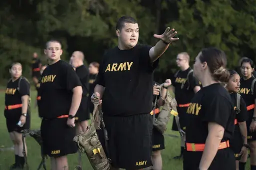 Students gather during physical training exercises in the new Army prep course at Fort Jackson in Columbia, S.C. Saturday, Aug. 27, 2022. The Army will expand its basic combat training for newly enlisted soldiers in what its leaders hope reflects a turning point as it prepares to meet the challenges of future wars. The added training will begin in October 2024 and comes as the Army works to reverse several years of dismal recruiting when it failed to meet its enlistment goals. (AP Photo/Sean Ray