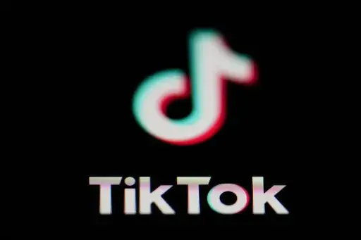 The icon for the video sharing TikTok app is seen on a smartphone, on Feb. 28, 2023. China accused the United States on Thursday, March 16, of spreading disinformation and suppressing TikTok following reports that the Biden administration was calling for its Chinese owners to sell their stakes in the popular video-sharing app. (AP Photo/Matt Slocum, File)