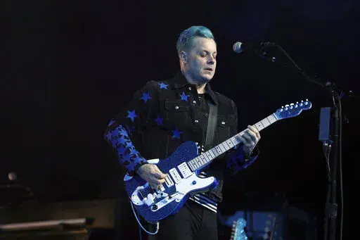 Jack White performs at the Masonic Temple Friday, April 8, 2022, in Detroit. White surprised fans by marrying musician Olivia Jean on stage during his Detroit homecoming show Friday. (Kirthmon F. Dozier /Detroit Free Press via AP)