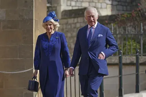 Britain's King Charles III and Camilla, the Queen Consort attend the Easter Mattins Service at St George's Chapel at Windsor Castle in Windsor, England, Sunday April 9, 2023. King Charles III will be taking a short cut and a smoother ride to Westminster Abbey on May 6, 2023, trimming the procession route his mother took in 1953 as he aims for a more modest coronation that will include some modern touches. (Yui Mok/Pool via AP, File)