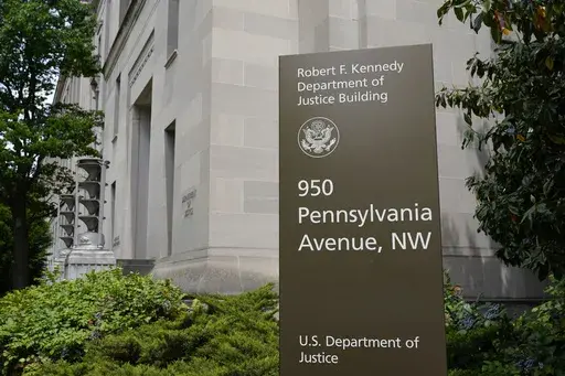 The exterior of the Robert F. Kennedy Department of Justice building is pictured on May 4, 2021, in Washington. U.S. regulators on Monday, Oct. 30, 2023, sued SolarWinds, a Texas-based technology company whose software was breached in a massive 2020 Russian cyberespionage campaign, for fraud for failing to disclose security deficiencies ahead of the stunning hack. Detected in December 2020, the SolarWinds hack penetrated U.S. government agencies, including the Justice and Homeland Security depar