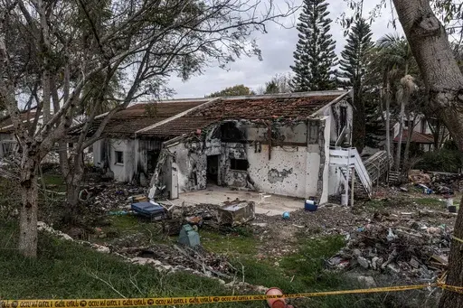 A battle-scarred home in Kibbutz Be'eri, an Israeli communal farm on the Gaza border, is seen on Thursday, Jan. 11, 2024. Hamas held more than a dozen hostages in the home when it overran southern Israel on Oct. 7. The Israeli military said Thursday that Israeli hostages held in a home that was struck by tank fire last Oct. 7 were killed by Hamas militants, not Israeli shelling, as it released the results of its first investigation into failures during the deadly attack that triggered the nine-m