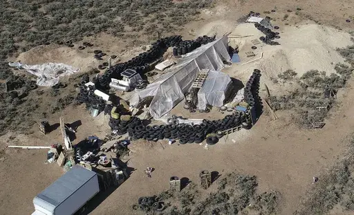 A ramshackle compound is seen in the desert area of Amalia, N.M., on Aug. 10, 2018. A U.S. judge is expected to hand down sentences Wednesday, March 6, 2024, for five defendants in a federal terrorism and kidnapping case that stemmed from the search for a toddler who went missing from Georgia in late 2017 that ended months later with a raid on the squalid compound in northern New Mexico. (AP Photo/Brian Skoloff, File)