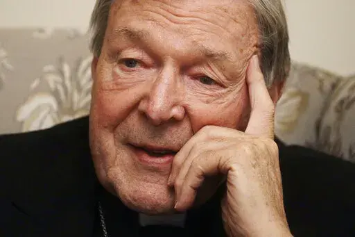 Cardinal George Pell answers a journalist's question during an interview with The Associated Press inside his residence near the Vatican in Rome, Nov. 30, 2020. Pell, who was the most senior Catholic cleric to be convicted of child sex abuse before his convictions were later overturned, has died Tuesday, Jan. 10, 2023, in Rome at age 81. (AP Photo/Gregorio Borgia, File)