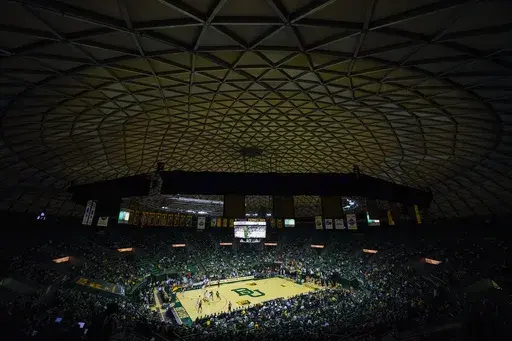 A crowd watches the first half of an NCAA college basketball game between Baylor and Mississippi Valley State, Friday, Dec. 22, 2023, in Waco, Texas. The game marks the final basketball matchup at the venue as the Baylor basketball team is scheduled to begin playing at Foster Pavilion. (AP Photo/Julio Cortez)