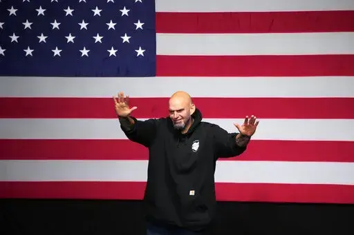 Pennsylvania Lt. Gov. John Fetterman, Democratic candidate for U.S. Senate, waves to supporters after addressing an election night party in Pittsburgh, Wednesday, Nov. 9, 2022. (AP Photo/Gene J. Puskar)