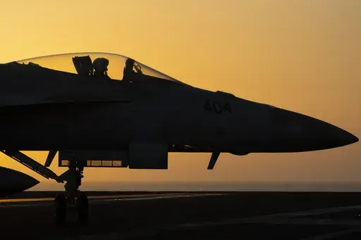 A fighter jet maneuvers on the deck of the USS Dwight D. Eisenhower in the Red Sea, June 11, 2024. (AP Photo/Bernat Armangue, File)