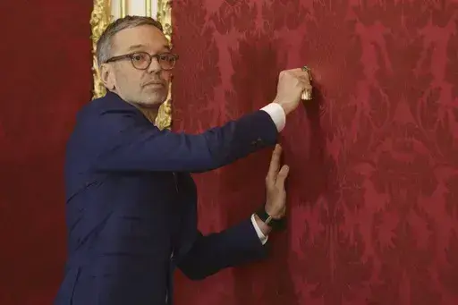Austria's Freedom Party leader Herbert Kickl leaves the presidential office, in Vienna, Austria, Monday, Jan. 06, 2025. (AP Photo/Heinz-Peter Bader)