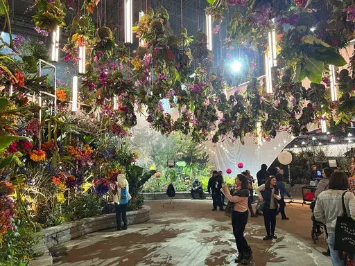 This March 3, 2023, image provided by Jessica Damiano shows "FLORASTRUCK," the orchid-adorned entrance garden at the 2023 Philadelphia Flower Show held at the Pennsylvania Convention Center in Philadelphia. (Jessica Damiano via AP)