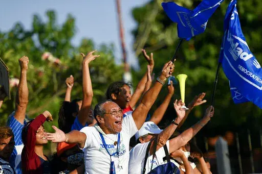 Supporters of opposition candidate for governor, Sergio Garrido, rally in Barinas, Venezuela, Jan. 6, 2022. Voters in the home state of Venezuela’s late President Hugo Chávez on Jan. 6, picked Garrido in a closely watched special election called after the contender representing that faction in November’s regular contest was retroactively disqualified as he was ahead in the vote count. (AP Photo/Matias Delacroix, File)