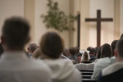 A congregation attends a service at Community Church of Seminole, Sunday, Feb. 23, 2025, in Seminole, Texas. (AP Photo/Julio Cortez)
