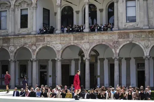 Models wear creations as part of the Valentino men's Spring Summer 2024 collection presented in Milan, Italy, Friday, June 16, 2023. (AP Photo/Luca Bruno)