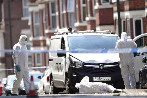 Police forensics officers search a white van on the corner of Maples Street and Bentinck Road in Nottingham, as three people have been found dead in the city in what police described as a "horrific and tragic incident". A 31-year-old man has been arrested on suspicion of murder after two people were found dead in the street in Ilkeston Road just after 4am on Tuesday. A third man was found dead in Magdala Road, Nottinghamshire Police said. Another three people are in hospital after someone tried 