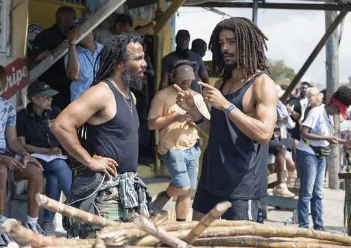 This image released by Paramount Pictures shows producer Ziggy Marley, left, and Kingsley Ben-Adir on the set of "Bob Marley: One Love." (Chiabella James/Paramount Pictures via AP)