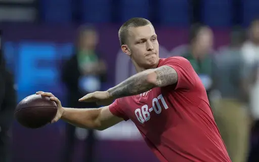 Shepherd quarterback Tyson Bagent runs a drill at the NFL football scouting combine in Indianapolis, Saturday, March 4, 2023. Bagent played most of his college career in relative obscurity at Division II Shepherd College in West Virginia. (AP Photo/Michael Conroy, File)