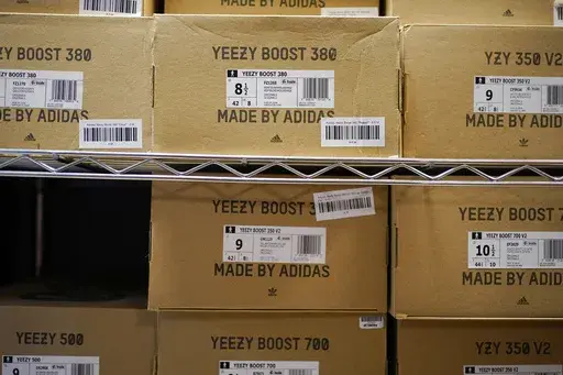 Boxes containing Yeezy shoes made by Adidas are seen at Laced Up, a sneaker resale store, in Paramus, N.J., Tuesday, Oct. 25, 2022. Adidas saw operating earnings dwindle in the first three months of the year as the German sportswear company's breakup with the rapper formerly known as Kanye West and his popular Yeezy shoe brand cost it 400 million euros ($441 million) in lost sales. Profit was down to 60 million euros from 437 million euros in the same quarter a year ago, while profit margin shra