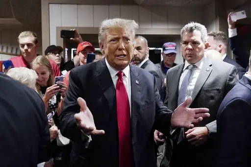 Former President Donald Trump greets supporters before speaking at the Westside Conservative Breakfast, June 1, 2023, in Des Moines, Iowa. As Ron DeSantis embarked on the first official week of his presidential candidacy, the Florida governor repeatedly hit his chief rival, Trump, from the right. (AP Photo/Charlie Neibergall, File)