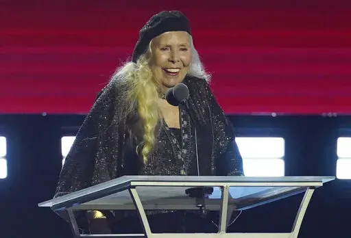Joni Mitchell accepts the Person of the Year award at the 31st annual MusiCares benefit gala on Friday, April 1, 2022, at the MGM Grand Conference Center in Las Vegas. (AP Photo/Chris Pizzello)