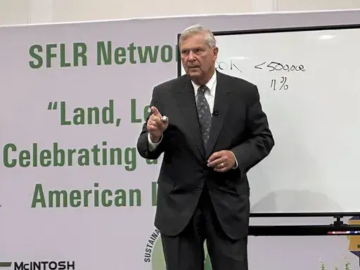 U.S. Agriculture Secretary Tom Vilsack speaks to a conference of Black forestland owners in Brunswick, Ga., on Tuesday, Aug. 22, 2023. Vilsack announced a new Biden administration program that will spend $150 million to help owners of small parcels of forestland partner with companies willing to pay them for carbon offsets and other environmental credits. (AP Photo/Russ Bynum)