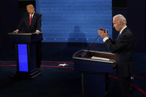 Democratic presidential candidate former Vice President Joe Biden, right, answers a question as President Donald Trump listens during the second and final presidential debate Oct. 22, 2020, in Nashville, Tenn. Twelve news organizations issued a joint statement calling on the presumptive presidential nominees President Biden and former President Trump to agree to debates during the 2024 campaign. ABC, CBS, CNN, Fox, PBS, NBC, NPR and The Associated Press all signed on to the letter. (AP Photo/Mor