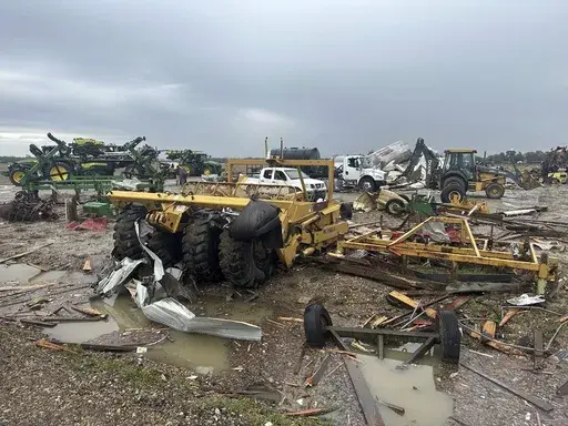 Damaged equipment sits on a farm struck by Wednesday night's tornado on Thursday, April 3, 2025, in Lake City, Ark. (AP Photo/Adrian Sainz)