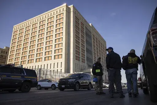 Federal enforcement officers stand outside the Metropolitan Detention Center, where Sean “Diddy” Combs is incarcerated, during an interagency operation, Monday, Oct. 28, 2024, in the Brooklyn Borough of New York. (AP Photo/Yuki Iwamura)