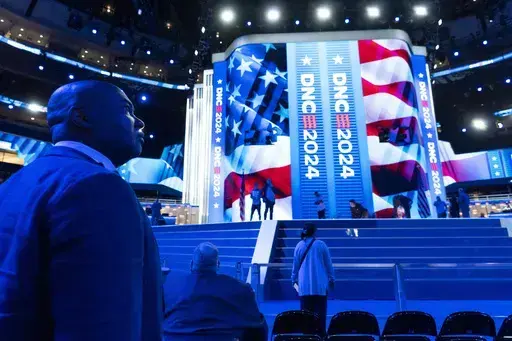 Jaime Harrison, Democratic National Committee chair, watches as preparations are made before the upcoming Democratic National Convention, Thursday, Aug. 15, 2024, in Chicago. (AP Photo/Alex Brandon)
