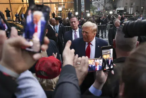 Former President Donald Trump speaks with construction workers at the construction site of the new JPMorgan Chase headquarters in midtown Manhattan, Thursday, April 25, 2024, in New York. (AP Photo/Yuki Iwamura, File)
