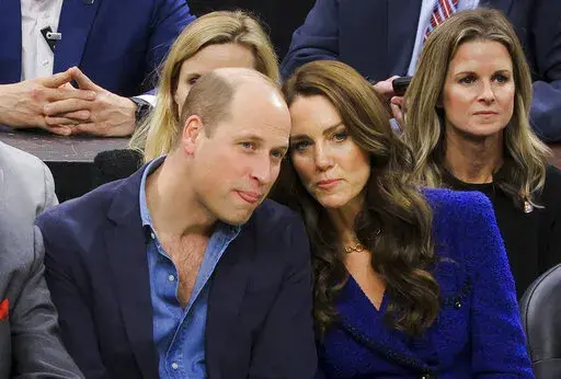Britain's Prince William and Kate, Princess of Wales, watch the NBA basketball game between the Boston Celtics and the Miami Heat on Wednesday, Nov. 30, 2022, in Boston. (Brian Snyder/Pool Photo via AP)