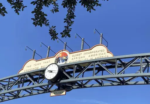 This undated photo shows the Eatonville sign in Eatonville, Fla. One of the first historically Black towns in the U.S. is suing the local school board to stop the sale of land that is tied up with Florida’s legacy of racial segregation and the state's fast-paced growth nowadays. An association dedicated to the preservation of the town of Eatonville’s cultural history on Friday sued the Orange County School board in Orlando, Florida. The town is perhaps best known through the writings of Harl