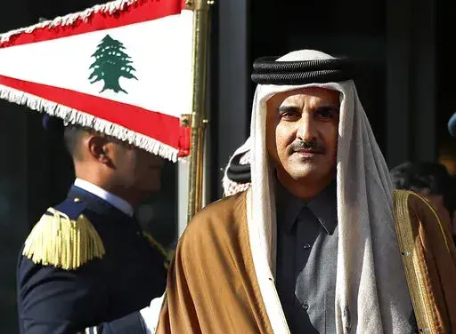 Qatar's Emir Sheikh Tamim bin Hamad Al Thani reviews the honor guard as he arrives at the Rafik Hariri international airport in Beirut, Lebanon, Sunday, Jan. 20, 2019. (AP Photo/Hussein Malla, File)