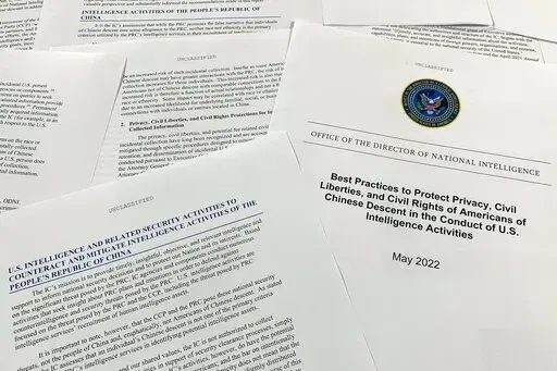 A report issued by the Office of the Director of National Intelligence is photographed in Washington, June 14, 2022. As America's intelligence agencies ramp up efforts against China, top officials acknowledge they may also end up collecting more phone calls and emails from Chinese Americans, raising new concerns about spying affecting civil liberties. The new report makes several recommendations, from expanding unconscious bias training to reiterating internally that federal law bans targeting s