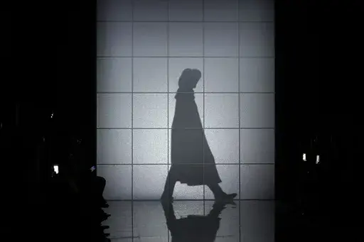 A model wears a creation as part of the Giorgio Armani women's Fall-Winter 2024-25 collection presented in Milan, Italy, Sunday, Feb. 25, 2024. (AP Photo/Luca Bruno)