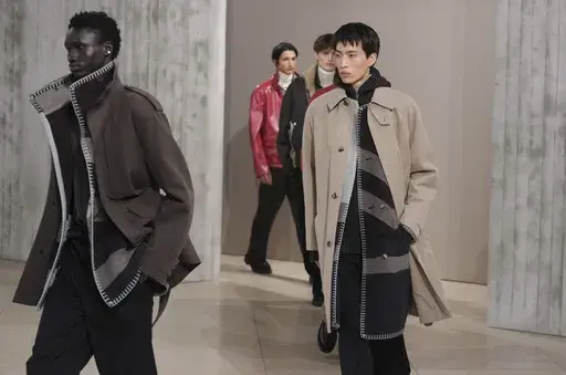 Models wear creations for the men's Hermes Fall-Winter 2025-2026 collection, that was presented in Paris, Saturday, Jan. 25, 2025. (AP Photo/Michel Euler)