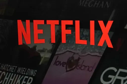 The Netflix logo is displayed on the company's website on Feb. 2, 2023, in New York. Netflix on Tuesday, May 23, 2023, outlined how it intends to crack down on the rampant sharing of account passwords in the U.S., its latest bid to reel in more subscribers to its video streaming service amid a slowdown in growth. (AP Photo/Richard Drew, File)