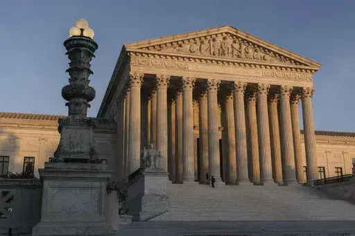 The Supreme Court is seen at sundown in Washington, on Nov. 6, 2020. The Supreme Court avoided a catastrophic accident in 2022 when a massive piece of marble at least two feet in length crashed to the ground in an interior courtyard used by the justices and their aides. (AP Photo/J. Scott Applewhite, File)