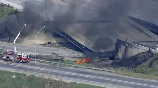 This screen grab from video provided by WPVI-TV/6ABC shows the collapsed section of I-95 with fire trucks on the scene in Philadelphia, Sunday, June 11, 2023. A report released on June 11, 2024, says the gasoline delivery truck that destroyed the I-95 bridge a year ago says gasoline spilled out from an unsecured hatch on the top of the tanker. (WPVI-TV/6ABC via AP)