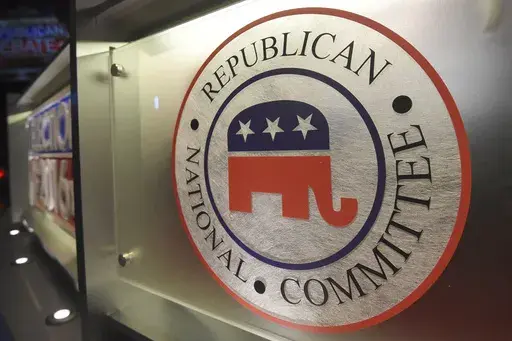 The Republican National Committee logo is shown on the stage as crew members work at the North Charleston Coliseum, Jan. 13, 2016, in North Charleston, S.C. Some Republican presidential candidates haven’t yet met polling and fundraising thresholds for the first 2024 debate, and now the stakes for making it to the second debate will be even higher. (AP Photo/Rainier Ehrhardt, File)