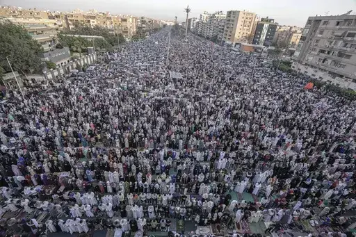Egyptian Muslims perform Eid al-Fitr prayers outside al-Seddik mosque in Cairo, Egypt, Friday, April 21, 2023. In the Middle East and North Africa, where religion is often ingrained in daily life's very fabric, rejecting faith can come with social or other repercussions, so many of the "nones," a group that includes agnostics, atheists and "nothing in particular" conceal that part of themselves, as blasphemy laws and policies are widespread in the region. (AP Photo/Amr Nabil, File)