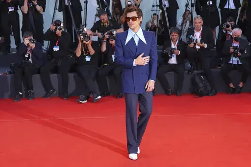 Harry Styles poses for photographers upon arrival at the premiere of the film 'Don't Worry Darling' during the 79th edition of the Venice Film Festival in Venice, Italy, Monday, Sept. 5, 2022. (Photo by Joel C Ryan/Invision/AP)