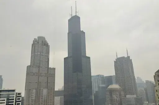The Willis Tower (formerly Sears Tower) is pictured in downtown Chicago, where the air quality has been categorized "unhealthy" by the U.S. Environmental Protection Agency, on June 27, 2023. The EPA says extensive swaths of the northern United States awoke to unhealthy air quality Monday, July 17, or were experiencing it by midafternoon. Fine particle pollution caused by smoke from Canada’s wildfires is causing a red zone air quality index, meaning it is unhealthy for everyone. (AP Photo/Clair