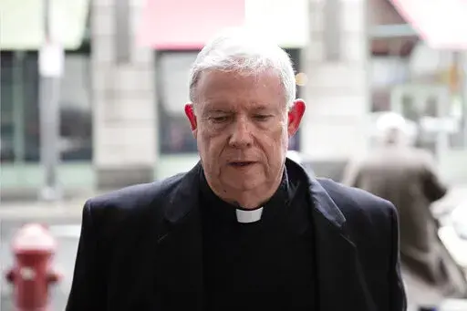FILE – Monsignor William Lynn arrives for a preliminary hearing in his retrial of his child endangerment case at the Center for Criminal Justice in Philadelphia, March 28, 2017. Lynn, the longtime secretary for clergy, was accused of sending a known predator, named on a list of problem priests he had prepared for Cardinal Bevilacqua, to an accuser’s northeast Philadelphia parish. Lynn served nearly three years in state prison before appeals courts threw out his felony child endangerment conv