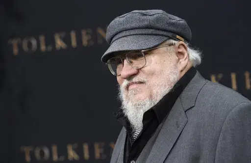 Author George R.R. Martin poses at the premiere of the film "Tolkien," at the Regency Village Theatre on May 8, 2019, in Los Angeles. Warner Bros. Discovery is sticking with safe bet franchises that will likely lure viewers, including a “Harry Potter” series and a “Game of Thrones” prequel for its rebranded Max streaming service, the company announced Wednesday, April 12, 2023. (Photo by Chris Pizzello/Invision/AP, File)