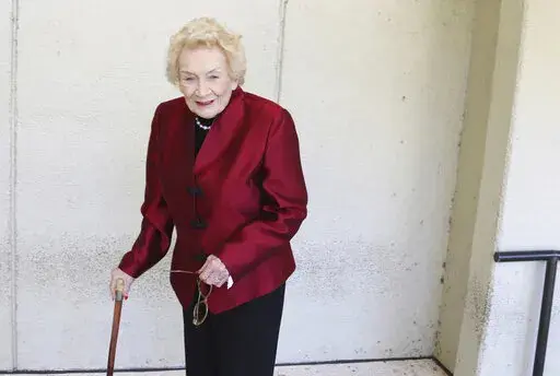 Native Hawaiian heiress Abigail Kawananakoa poses outside a Honolulu courthouse on Oct. 25, 2019. Kawananakoa, the so-called last Hawaiian princess whose lineage included the royal family that once ruled the islands and an Irish businessman who became one of Hawaii’s largest landowners, died on Sunday, Dec. 11, 2022. She was 96. (AP Photo/Jennifer Sinco Kelleher, File)