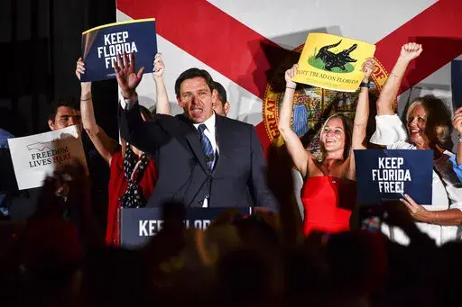 Republican gubernatorial incumbent Gov. Ron DeSantis, waves to supporters Tuesday, Aug. 23, 2022, in Hialeah, Fla. DeSantis will face U.S. Rep. Charlie Crist in November. (AP Photo/Gaston De Cardenas)