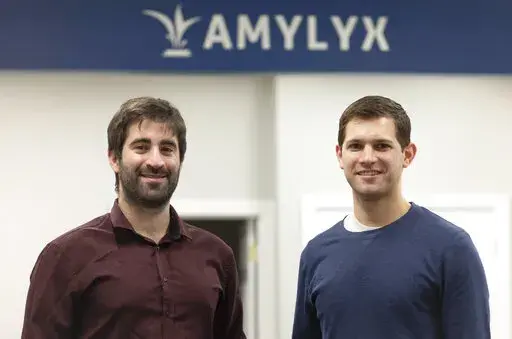This 2018 photo provided by Amylyx shows the company's co-founders Joshua Cohen, left, and Justin Klee in Cambridge, Mass. on Sept. 2, 2022. A closely watched experimental drug for Lou Gehrig’s disease is getting an unusual second look from U.S. regulators on Wednesday, Sept. 7, 2022, amid intense pressure to approve the treatment for patients with the fatal illness. Patients and their families have rallied behind the drug from Amylyx Pharma, launching an aggressive lobbying campaign and enlis