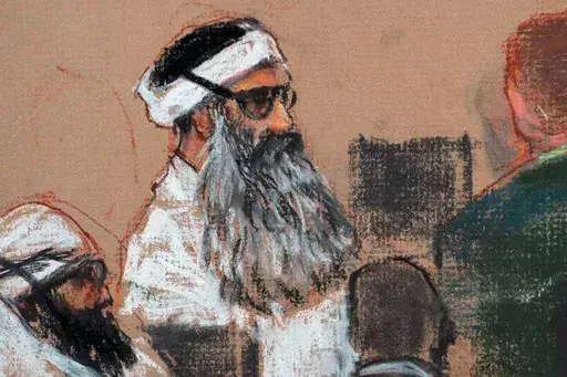 This Monday, Dec. 8, 2008 courtroom drawing by artist Janet Hamlin and reviewed by the U.S. military, shows Khalid Sheikh Mohammed, center, and co-defendant Walid Bin Attash, left, attending a pre-trial session at Guantanamo Bay Naval Base, Cuba. The man accused of being the main plotter in al-Qaeda's Sept. 11, 2001 attacks has agreed to plead guilty, The Defense Department said Wednesday. (AP Photo/Janet Hamlin, Pool, File)
