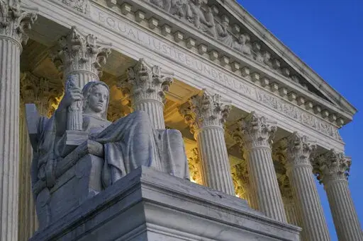 Light illuminates part of the Supreme Court building on Capitol Hill in Washington, Wednesday, Nov. 16, 2022. The Biden administration plans to ask the Supreme Court to reinstate the president's student debt cancellation plan, according to a Thursday legal filing warning that Americans will face financial strain if the plan remains stalled in court when loan payments are scheduled to restart in January. (AP Photo/Patrick Semansky)