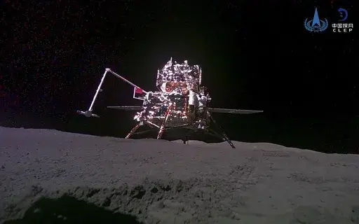 FILE -This China National Space Administration (CNSA) handout image released by Xinhua News Agency, shows the lander-ascender combination of Chang'e-6 probe taken by a mini rover after it landed on the moon surface, June 4, 2024. China's Chang'e 6 probe returned on Earth on Tuesday with rock and soil samples from the little-explored far side of the moon in a global first. The probe landed in northern China on Tuesday afternoon in the Inner Mongolian region. (CNSA/Xinhua via AP, File)
